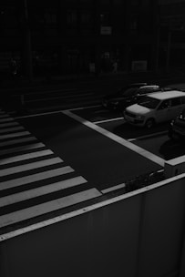 white car on pedestrian lane