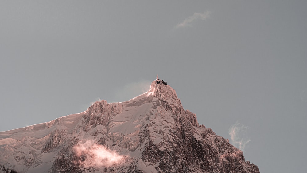 person standing on top of mountain during daytime