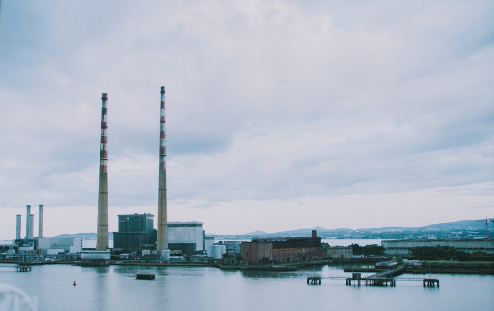 white and brown concrete building near body of water during daytime