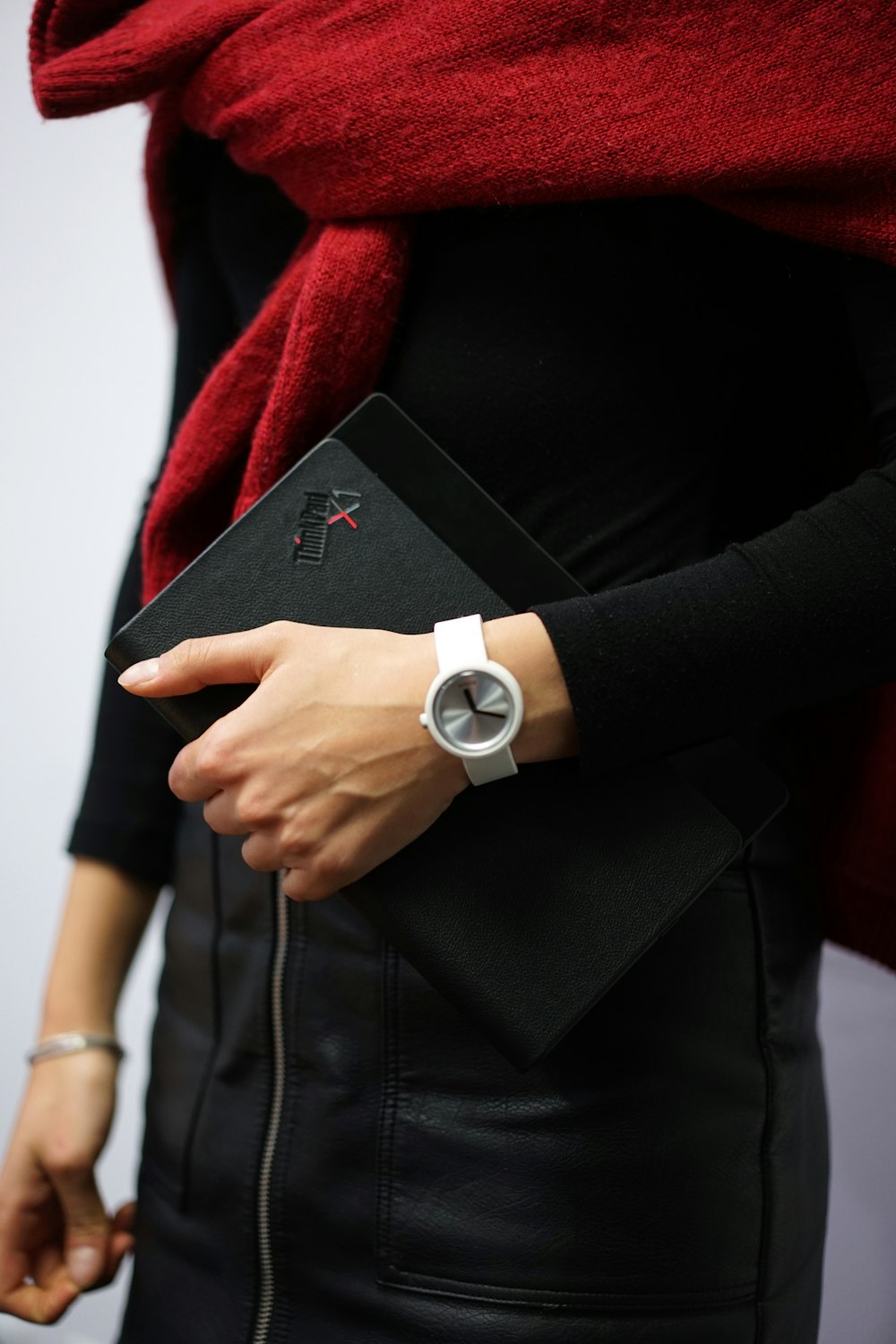 woman in black blazer and white round analog watch