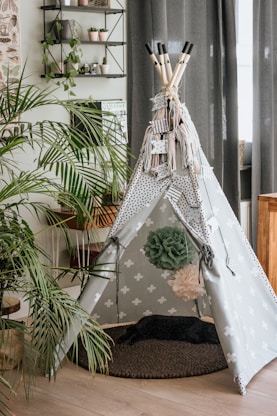 white hammock near green palm plant