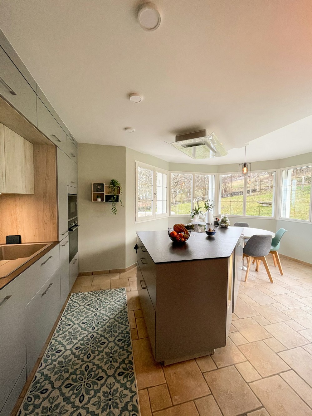 brown wooden kitchen cabinet near white wooden table