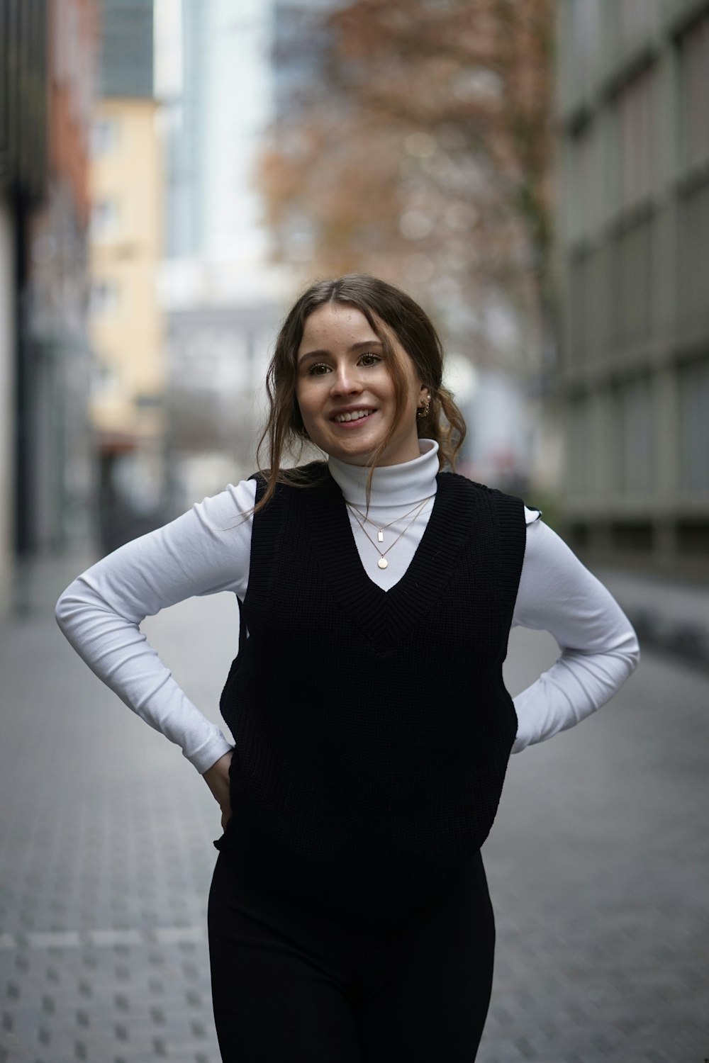 woman in black dress smiling