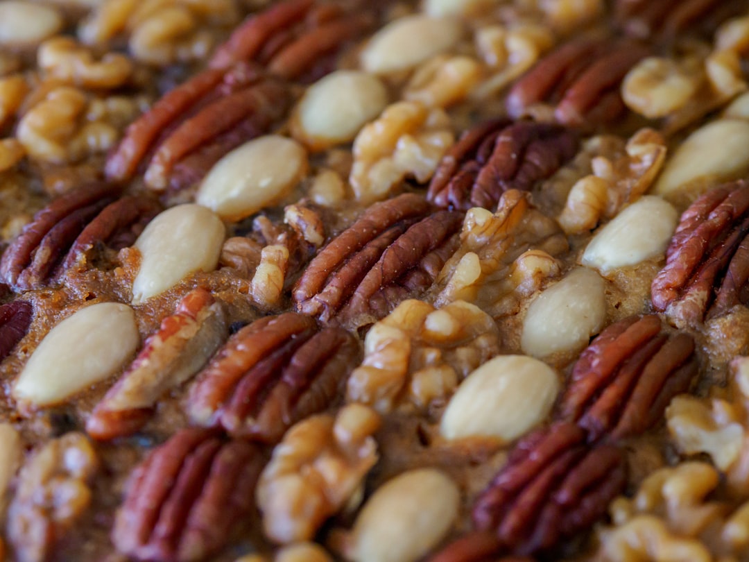 brown and white nuts on white surface