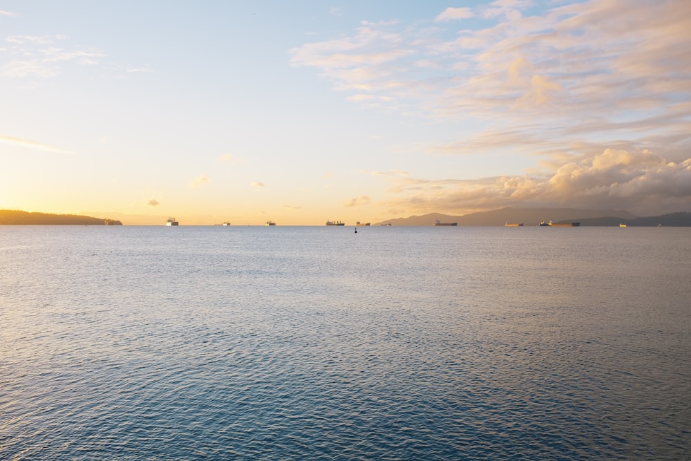 body of water during sunset