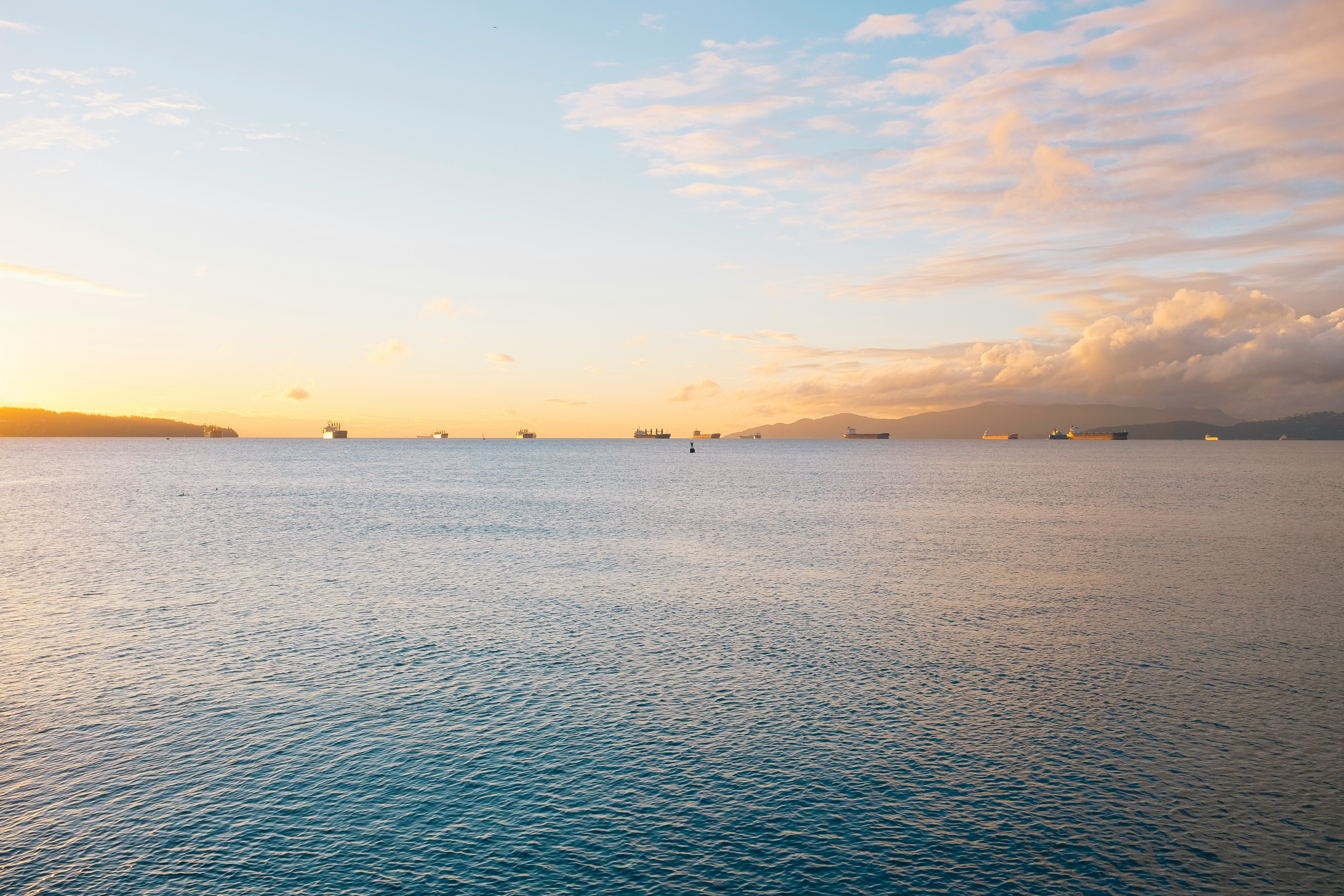 body of water during sunset