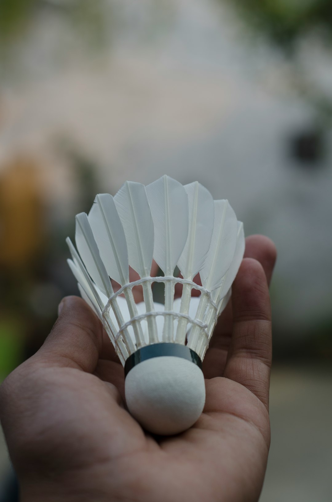 person holding white paper boat