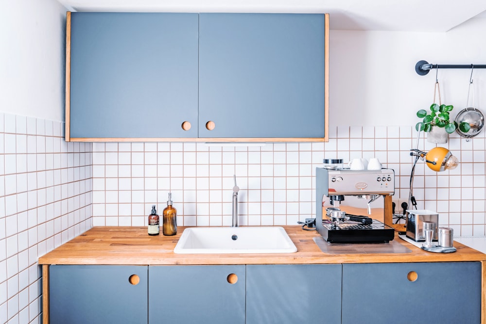 white ceramic sink with faucet