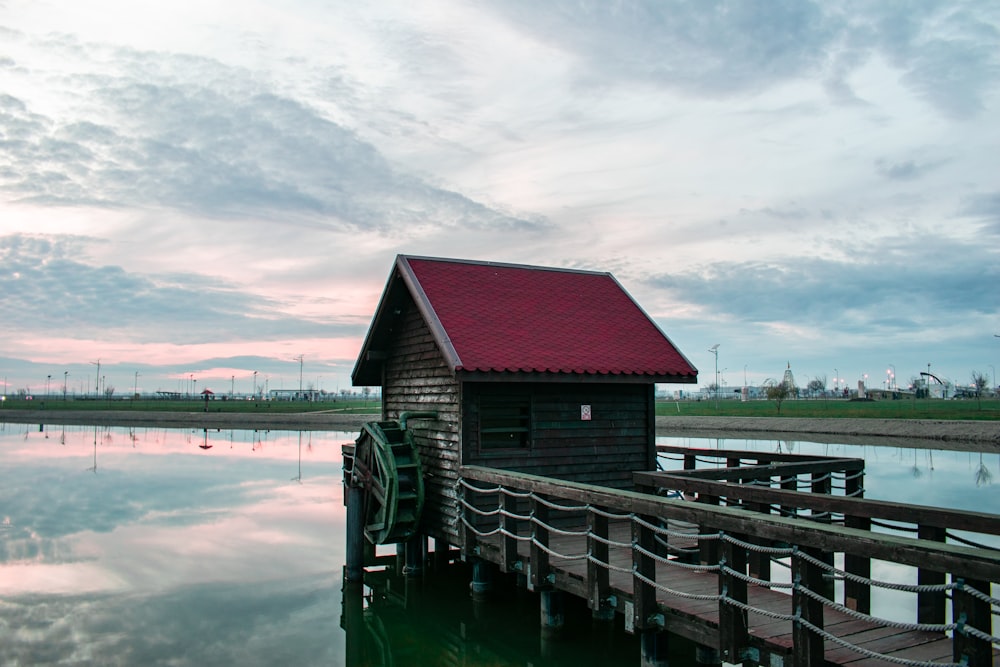 brown wooden dock on lake during daytime