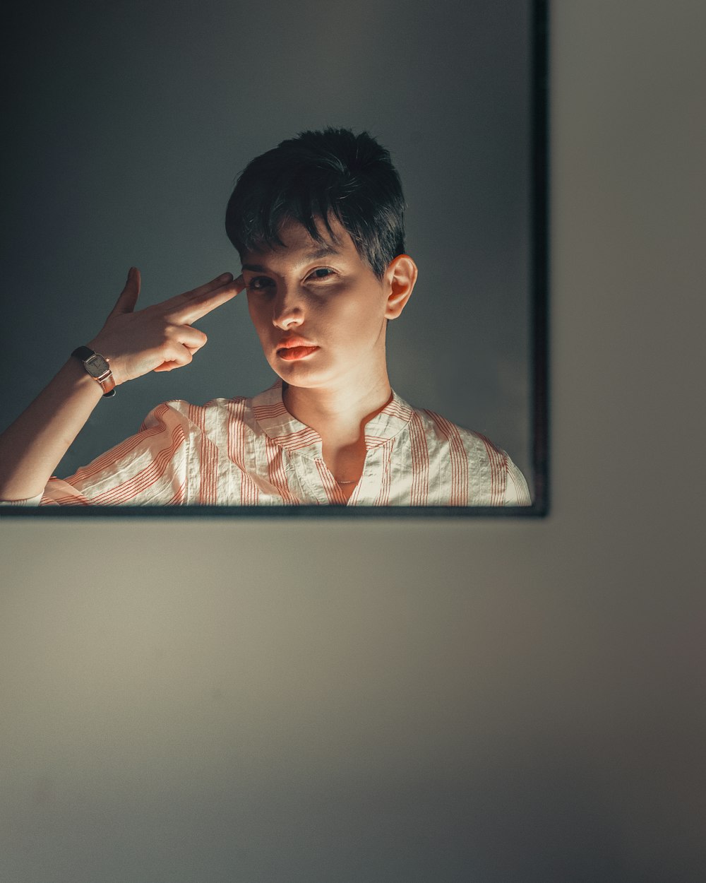 man in pink and white plaid button up shirt