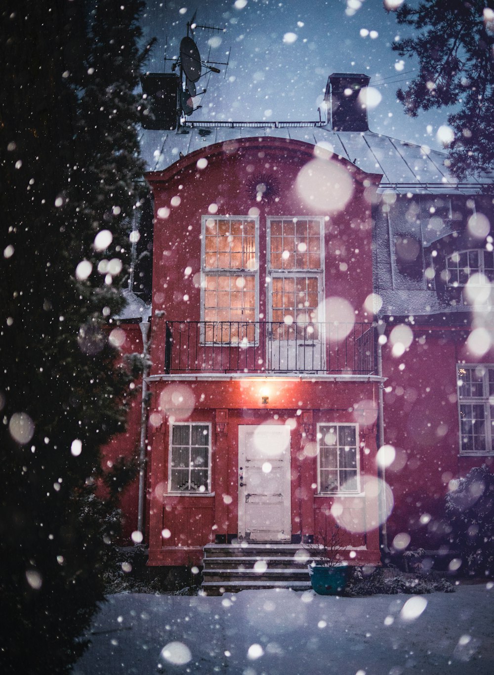 red and white house with snow on roof