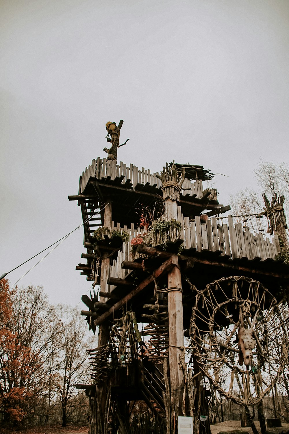 brown wooden tower with cross on top