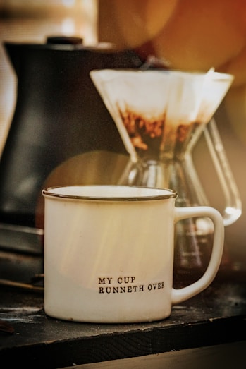 white ceramic mug with coffee