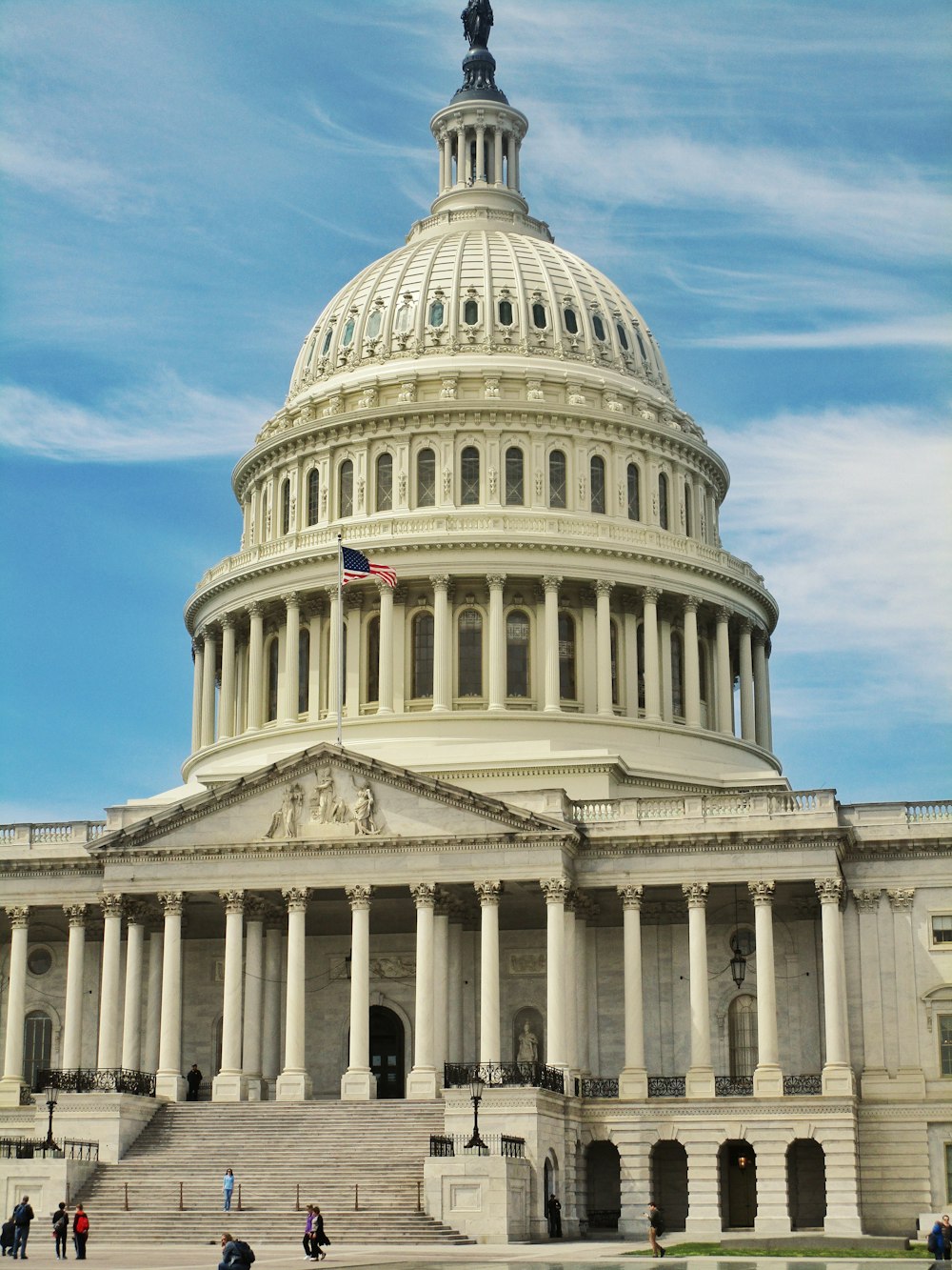 white concrete building under blue sky during daytime