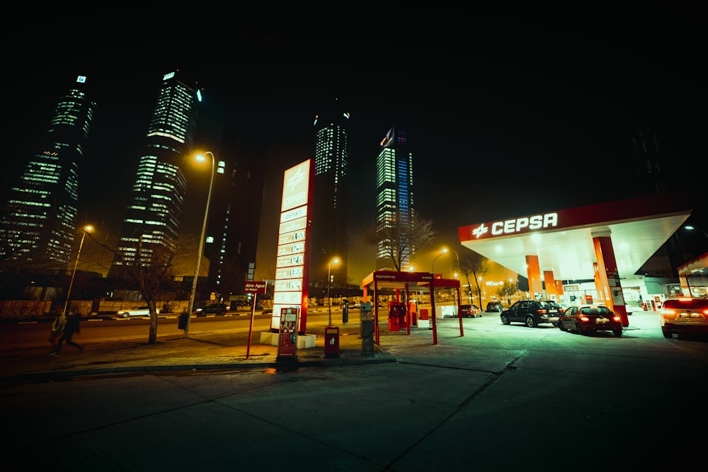 cars parked in front of building during night time