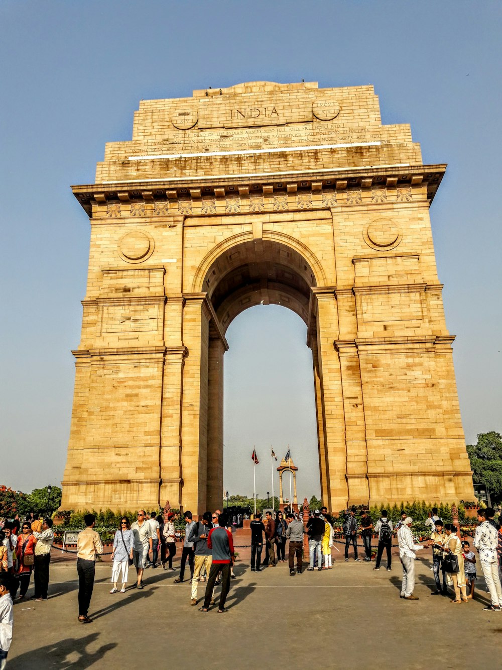 people walking on brown concrete arch during daytime