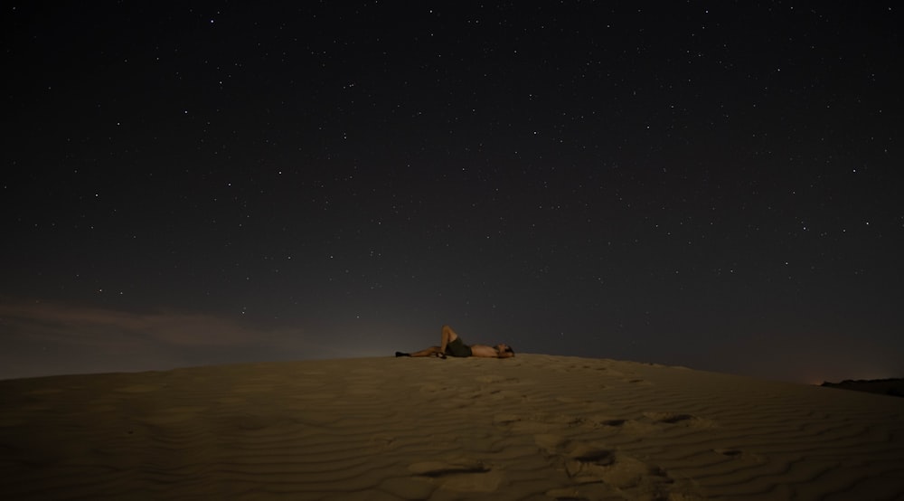 brown sand under starry night