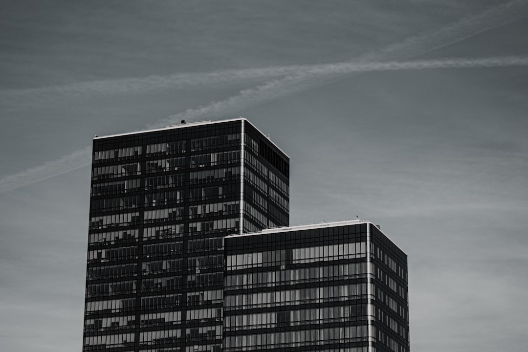 black and white concrete building under blue sky during daytime