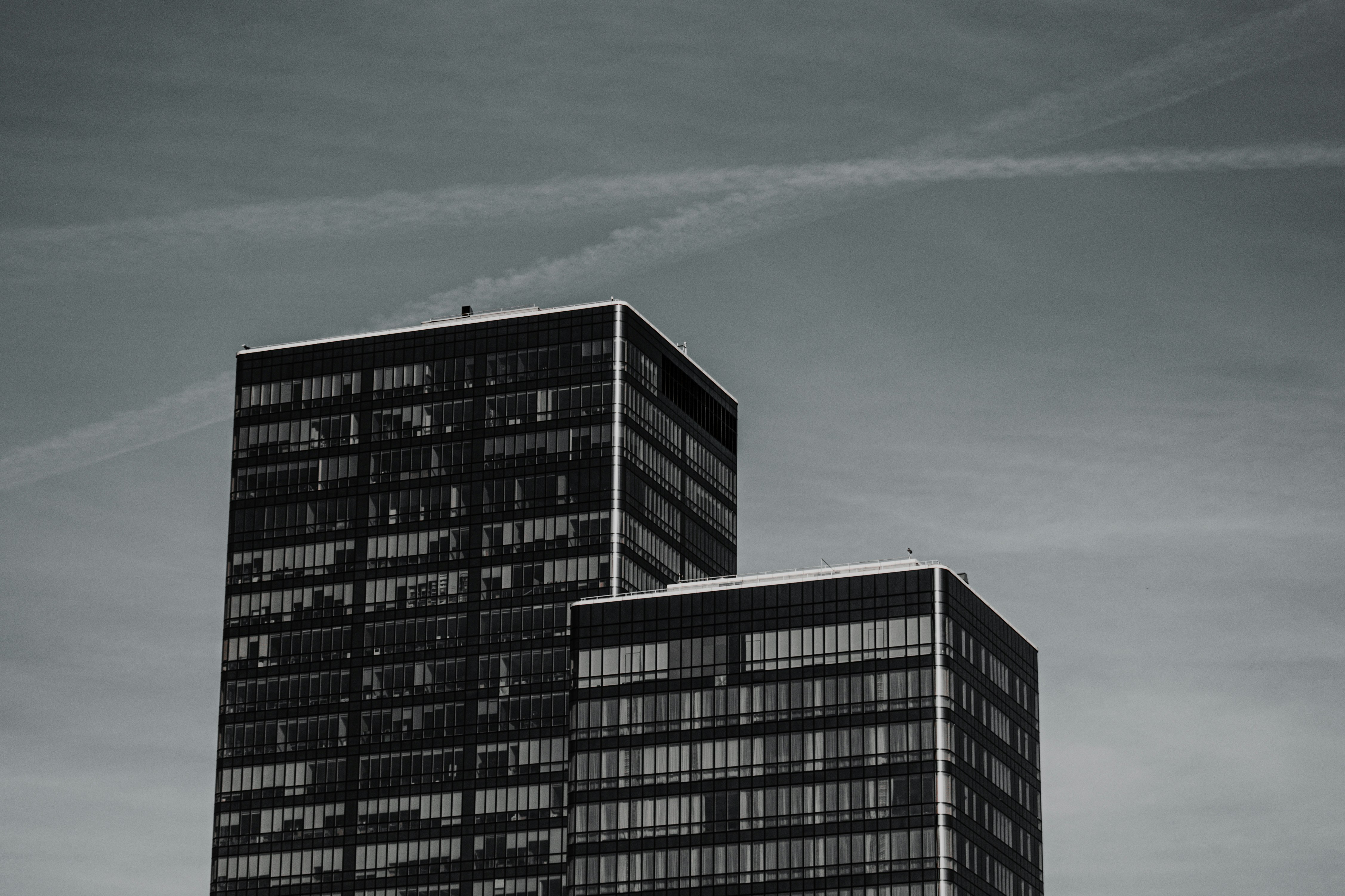 black and white concrete building under blue sky during daytime