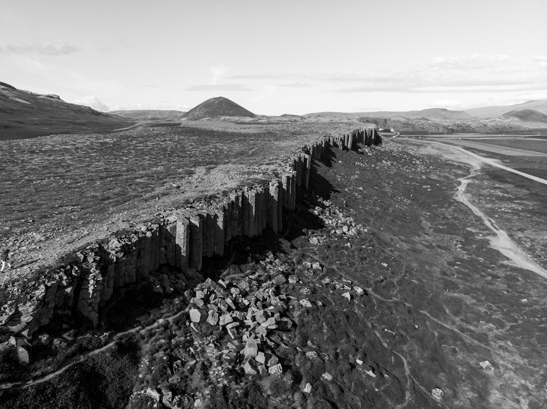 grayscale photo of rocky mountain