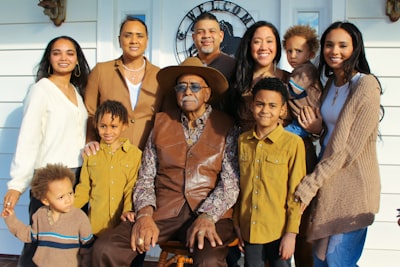 group of people sitting on chair family reunion teams background