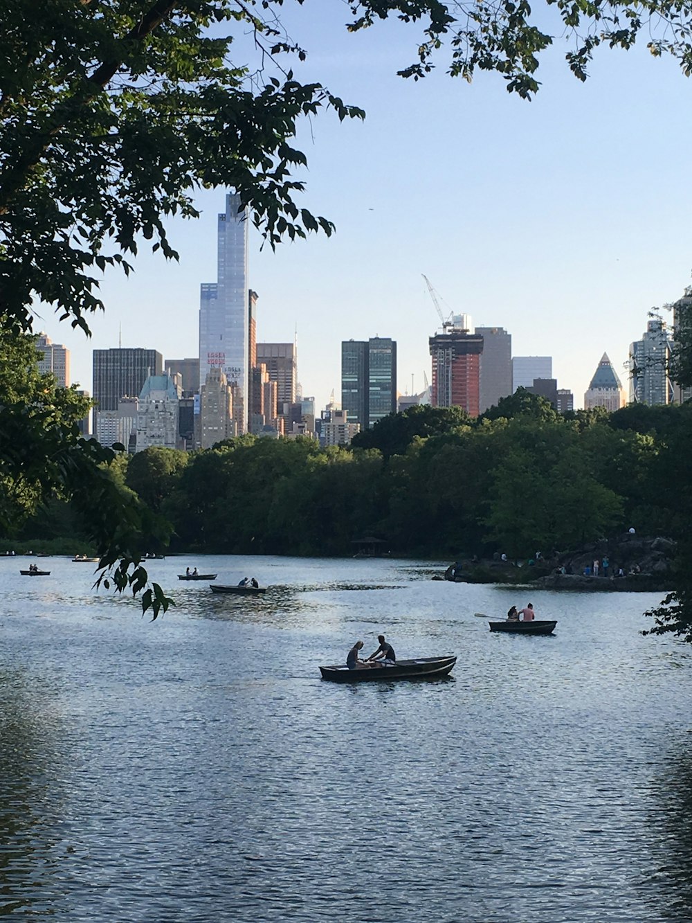 people riding on boat on river during daytime