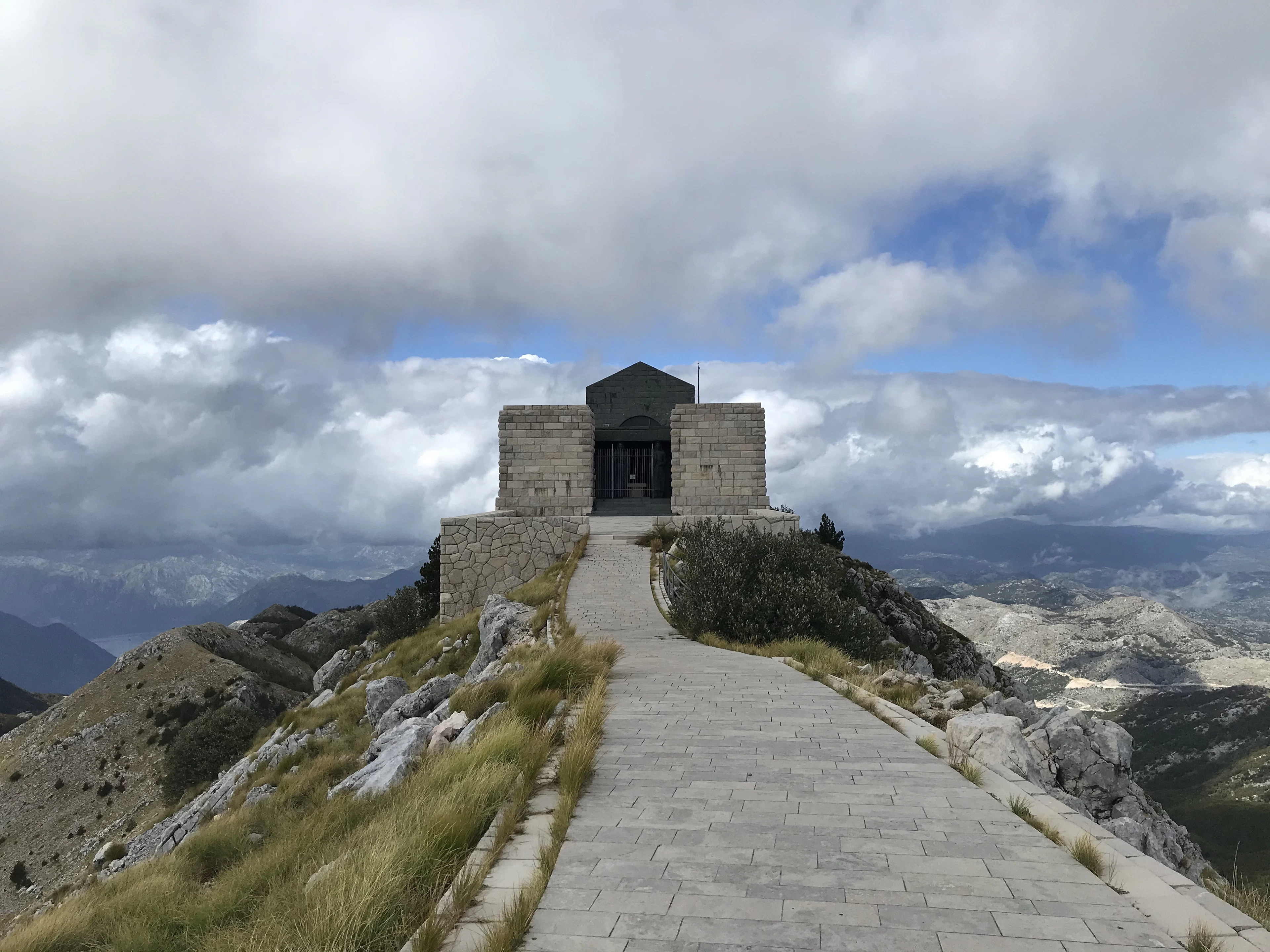 The path to Njegoš's mausoleum on the summit of Lovćen beneath a cloudy sky