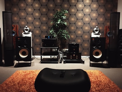 A cozy living room setup featuring a high-quality audio system with speakers and a receiver.