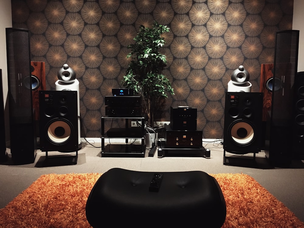 black and silver speakers on white table