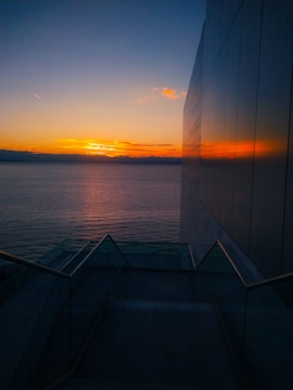 A bright, modern Miami condo with ocean views at sunset