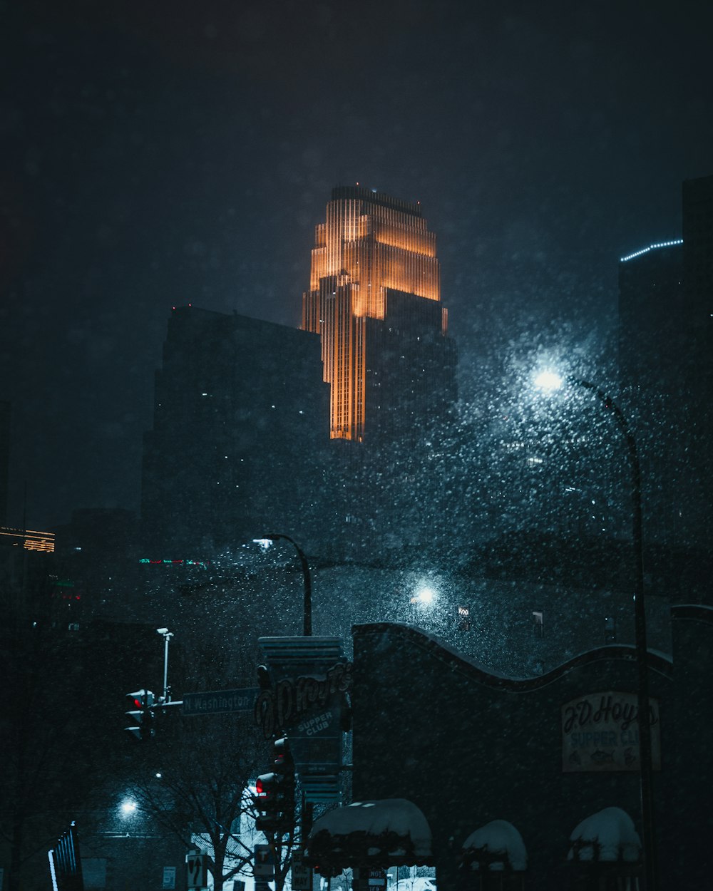 brown wooden building with lights during night time