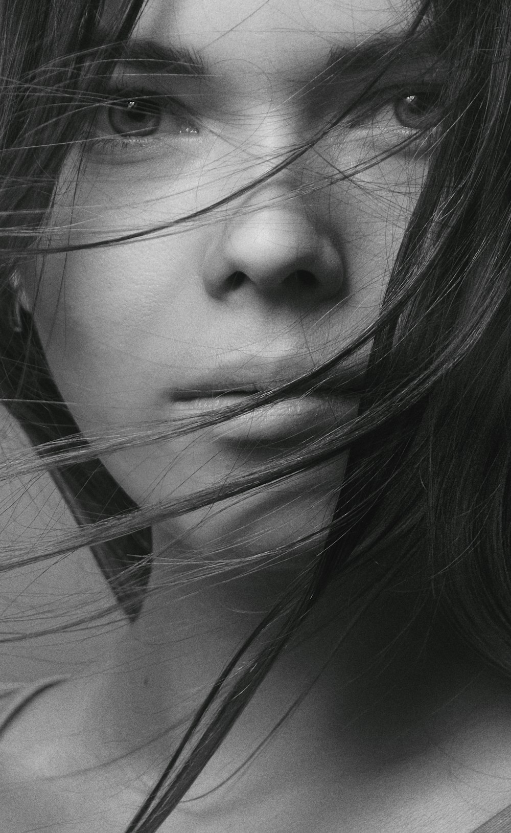 grayscale photo of womans face