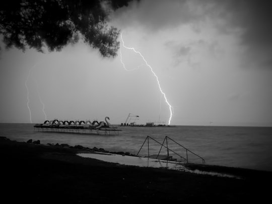 grayscale photo of sea waves crashing on shore in Balaton Lake Hungary