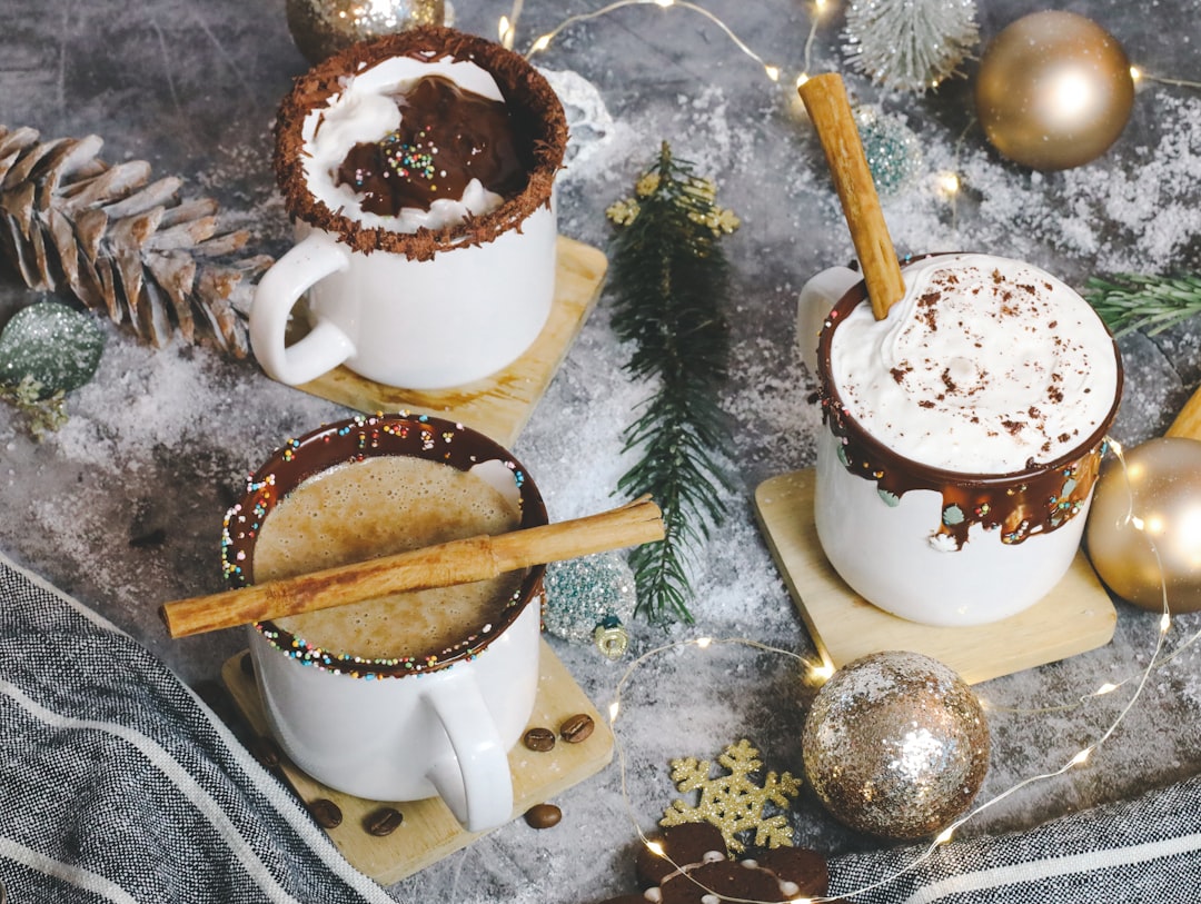 white ceramic mug with coffee on table