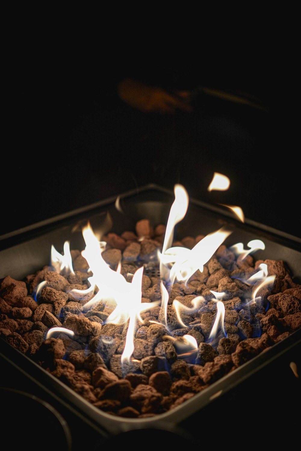 white and brown fire on black surface