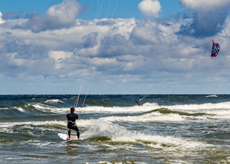 person surfing on sea waves during daytime