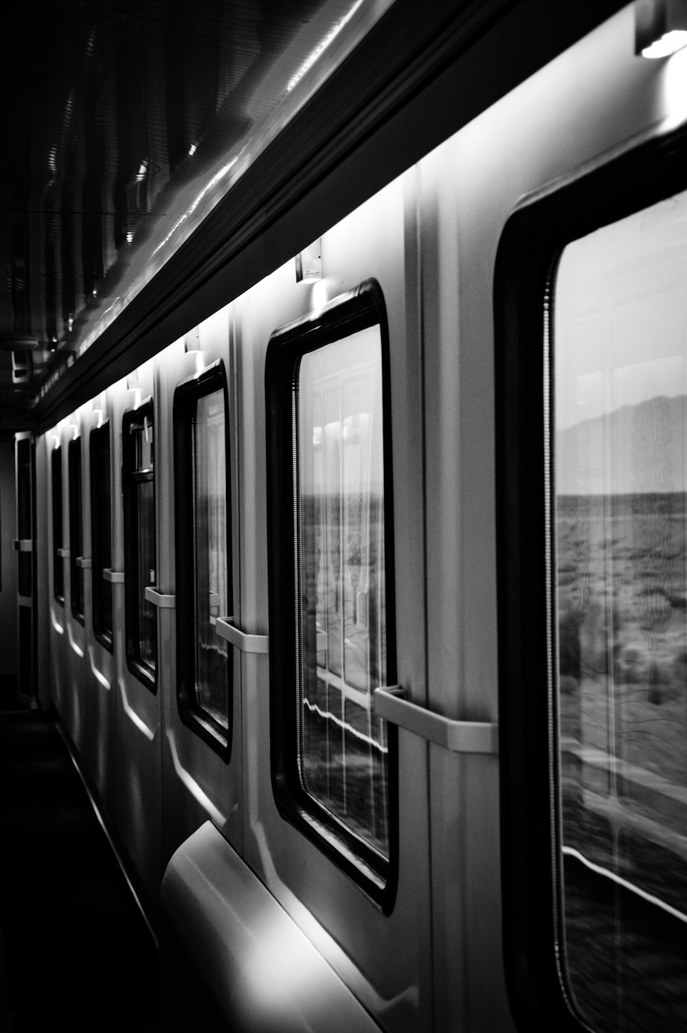 grayscale photo of train door