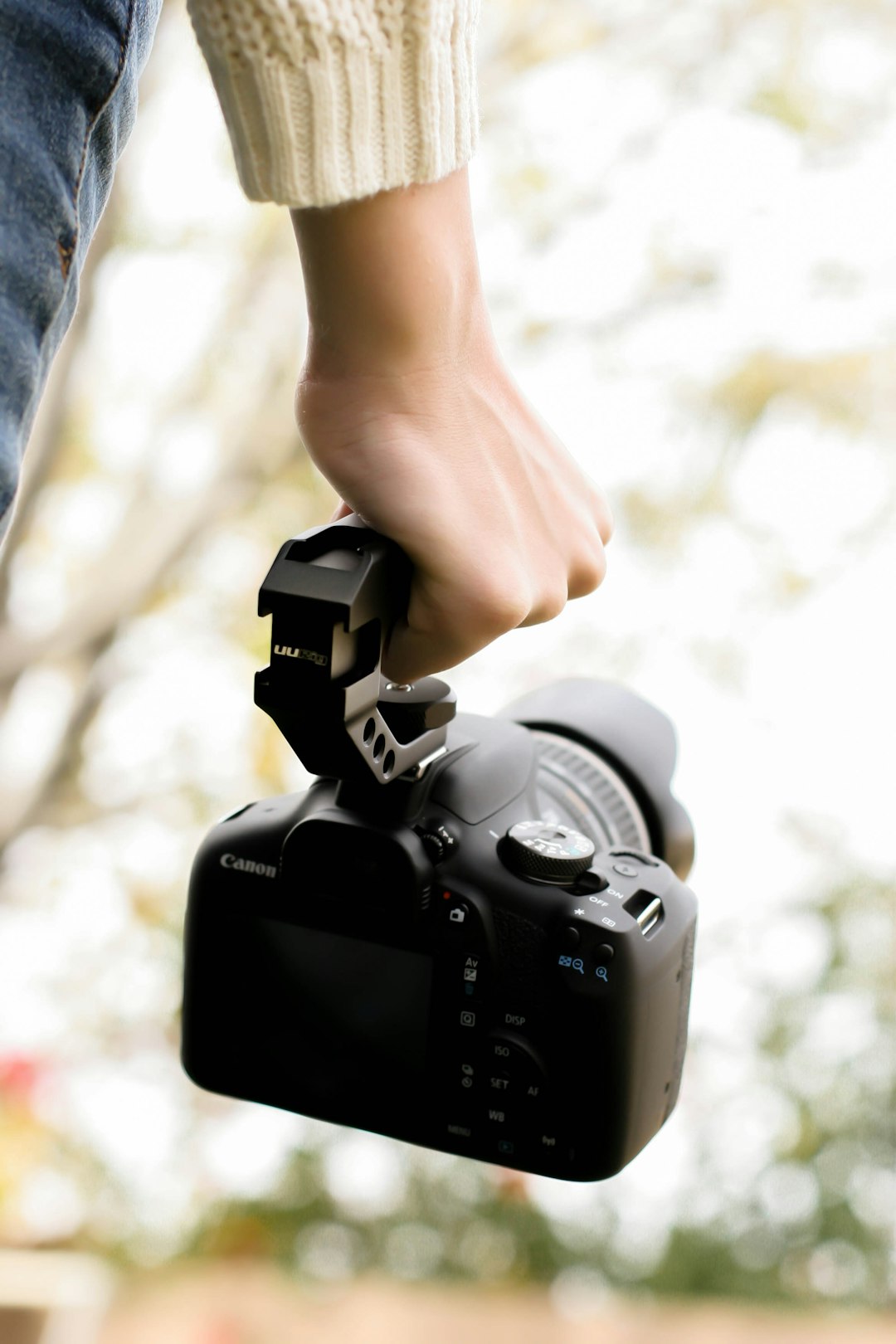 person holding black dslr camera