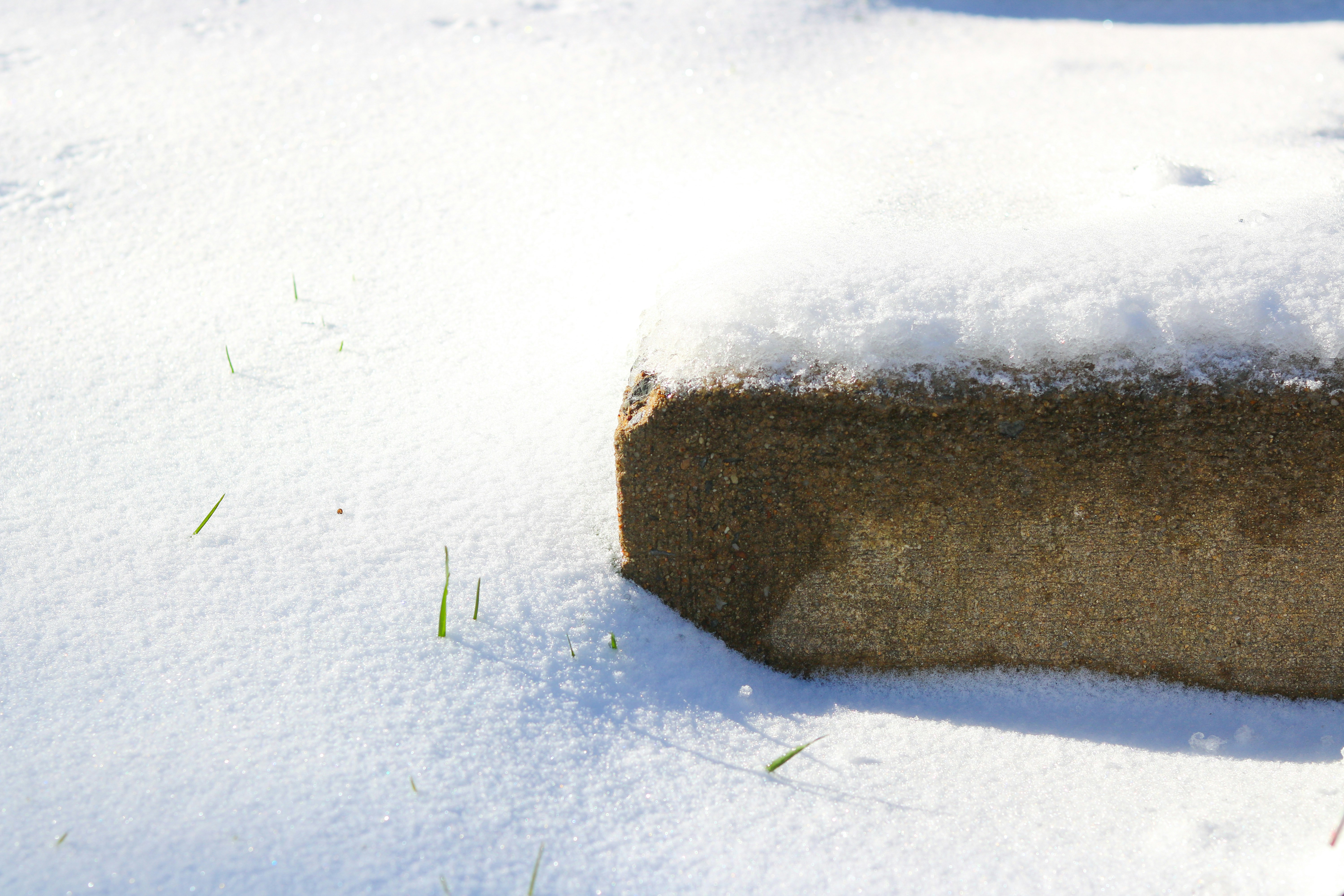 gray stone on white snow