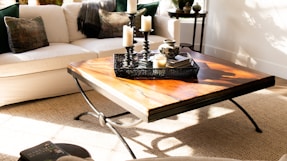 black candle holder on brown wooden table