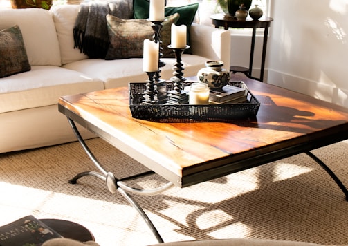 black candle holder on brown wooden table