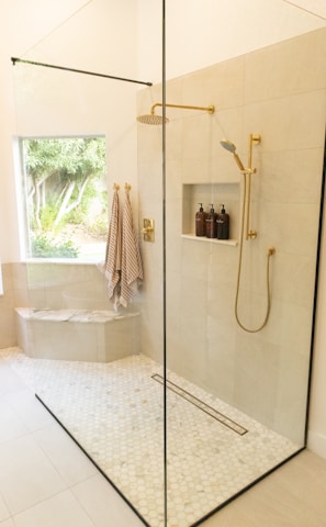 white bathtub with shower curtain