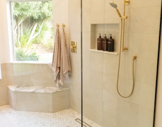white bathtub with shower curtain
