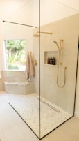 white bathtub with shower curtain