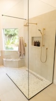 white bathtub with shower curtain