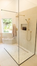 white bathtub with shower curtain