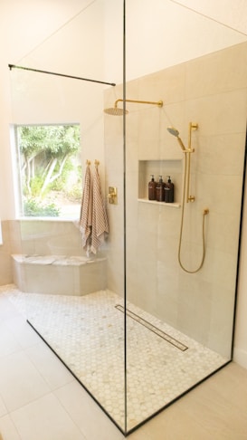 white bathtub with shower curtain