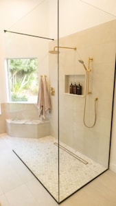 Premium Walk-In Shower - Elegant walk-in shower with luxury tile work and fixtures by Sage Kitchen and Bath in Bathroom
