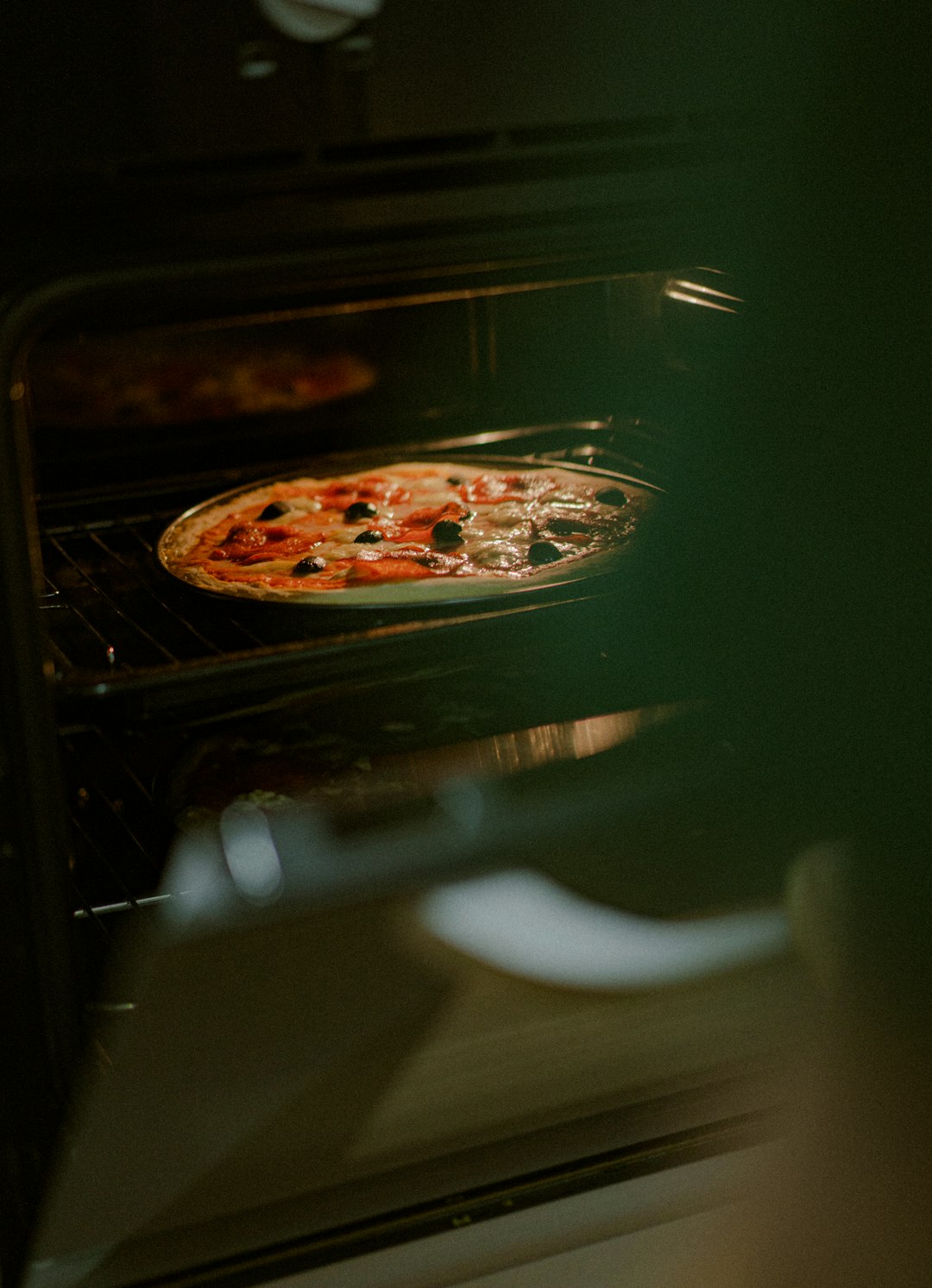 pizza on stainless steel tray