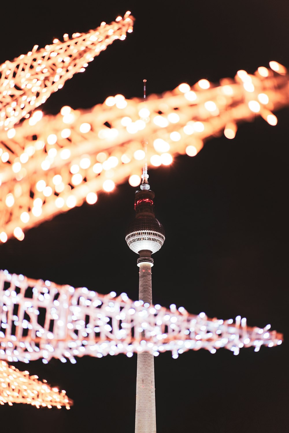 white and black tower with lights during night time